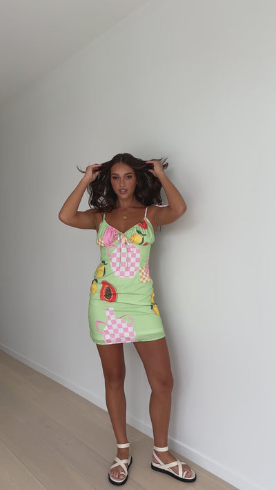 Load and play video in Gallery viewer, Everly Mini Dress - Green Vase Print
